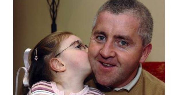 Donal Fenton gets a kiss from his daughter, Aimee, in their home in Ladysbridge, Co Cork. Donal donated one of his kidneys last July in a bid to save his ... - image