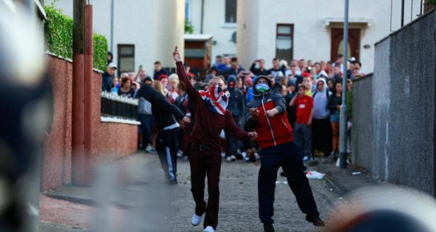 Loyalists clash with police in the Woodvale Road area of north Belfast on the second night of violence after an Orange Parade was blocked from marching past the Nationalist Ardoyne area. Photograph: Cathal McNaughton/Reuters.