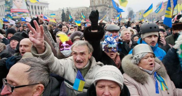 Pro-European protesters shout slogans and gesture during a rally at Independence Square in Kiev. Photograph:L Gleb Garanich/Reuters