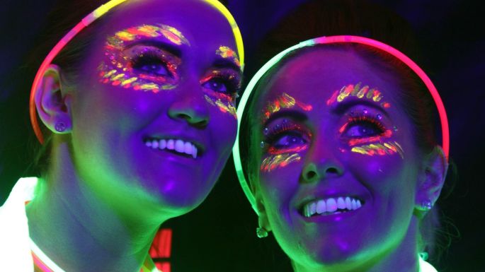 ... energising dance music, colourful inflatable worlds, glow sticks, glow glasses and anything neon. Photographed here are Jennifer Jago and Jeannette ... - image