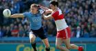 Dublin’s Eoghan O’Gara keeps possession from  Chrissy McKaigue of Derry in the National Football League Division One final at Croke Park. Photograph: Donall Farmer/Inpho.