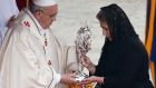 Floribeth Mora, from Costa Rice, who it is claimed was cured of a brain aneurism after praying to  John Paul II, presents his relics to Pope Francis during the canonisation in Rome. Photograph: Dan Kitwood/Getty