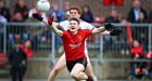 Tyrone’s Peter Harte and Conor Maginn of Down battle for possession during the Ulster SFC preliminary round replay at Páirc Esler in Newry. Photograph:   Cathal Noonan/Inpho