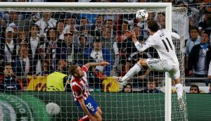 Real Madrid’s Gareth Bale heads home his side’s second goal in extra-time during the  the  Champions League final  against Atletico Madrid at Estadio da Luz  in Lisbon. Photograph: Paul Hanna/Reuters 