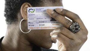 An asylum seeker with her ID card. Photograph: Rory O’Neill, part of the Irish Refugee Council exhibition ‘One Year On, and Still No Change’, at Powerscourt Gallery, Dublin, until June 3