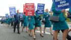 Aer Lingus pilots and cabin crew on strike over their rosters photographed marching at Dublin Airport today. Photograph: Brenda Fitzsimons/The Irish Times