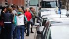 A dole queue on Bishop Street, Dublin. The 2014 UN Human Development report calls for a commitment to full employment, which it says brongs social benefits. 