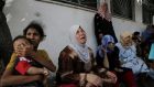 Displaced Palestinian women  cry after an Israeli airstrike hit their  shelter in a UN school, at Beit Hanoun hospital in the northern Gaza Strip, yesterday. Photograph: Adel Hana/AP