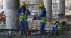 Migrant labourers work on a construction site last October in Doha in Qatar. Photograph: AFP 