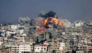 Smoke and fire from the explosion of an Israeli strike rise over Gaza City on Tuesday. Photograph: AP Photo/Hatem Moussa