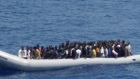 A file image of migrants sitting on a boat during a rescue operation by the Italian navy some 60km off the coast of Libya earlier this month. Photograph: Marina Militare/Handout via Reuters