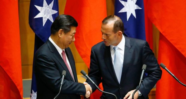 China’s President Xi Jinping (L) shakes hands with Australian Prime Minister Tony Abbott after a signing ceremony for a free trade deal at Parliament House in Canberra. Photograph: David Gray/Reuters