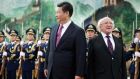 President Michael D Higgins and China’s president Xi Jinping inspect honour guards during a welcoming ceremony inside the Great Hall of the People in Beijing. Photograph: Jason Lee/Reuters