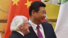 President Michael D Higgins and Chinese president Xi Jinping wait for the start of a signing ceremony in Beijing’s Great Hall of the People on Tuesday. Photograph: Greg Baker/EPA