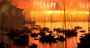 While festivities haven't fully kicked off in Ireland yet, people around the world are gearing up to usher in the New Year and some have already had their countdowns. Here, boats are silhouetted as fireworks shower down from the Sydney Harbour Bridge during the annual fireworks display on January 1st, 2015. Photograph: REUTERS/Jason Reed 