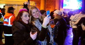 Revellers cheer in the new year at the NYF concert in College Green, Dublin.
Photograpgh: Aidan Crawley
