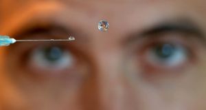 PHOTOGRAPHER OF THE YEAR: Alan Betson - The Irish Times. RAINDROP:  Alistair McClymont with a raindrop hovering in mid-air, as part of Strange Weather: Forecasts from the Future exhibition at Dublin's  Science Gallery.