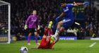 Chelsea’s  striker Diego Costa (R) comes together with Liverpool’s  during the Capital One Cup semi-final, second leg at Stamford Bridge. Photograph: Ben Stansall/AFP 