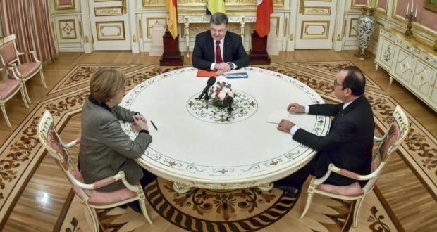 Ukrainian President Petro Poroshenko (centre), German chancellor Angela Merkel and French President Francois Hollande during their talks in Kiev yesterday. Mykola Lazarenko/AFP/Getty Images