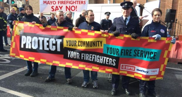 Fire services personnel protest outside Government Buildings in Dublin. Photograph: Cyril Byrne/The Irish Times