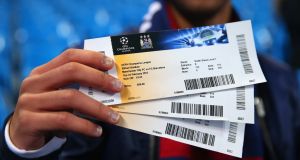 <b>Hottest tickets in town </b> <br>
 A fan holds up his match day tickets prior to the last 16 match between Manchester City and Barcelona at the Etihad Stadium in Manchester.  Photo: Alex Livesey/Getty