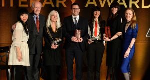 The judges and the winners: (From left) Judges Xiaolu Guo, Ciaran Carty, Paula Meehan (Hall of Fame). Simon Lewis (Emerging Poetry winner), Sara Baume (Emerging Fiction and Writer of the Year winner), Henrietta McKervy (First Fiction winner) and  judge Martina Devlin, at the 44th Annual Hennessy Literary Awards which recognise and reward emerging Irish writers and poets in the literary sphere. 
Photograph: Dara Mac Donaill / The Irish Times