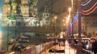 The body of Russian opposition leader Boris Nemtsov is covered with plastic lies on Moskvoretsky bridge near St. Basil cathedral  in central Moscow. Photograph: AFP 