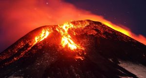 Ash and lava spew from the Villarrica volcano, as seen from Pucon town in the south of Santiago in Chile on Tuesday. Photograph: Lautaro Salinas/Reuters.
