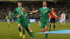 Republic of Ireland striker Shane Long celebrates scoring the equaliser with Wes Hoolahan and James McClean during the Euro 2016 Group D qualifying game  at the Aviva Stadium. Photograph: Niall Carson/PA 