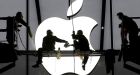 Workers prepare for the opening of an Apple store in Hangzhou. IPhone sales in greater China have outpaced those in the US for the first time. Photograph: Reuters/Chance Chan