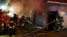 Baltimore firefighters fight fires in Baltimore overnight. Maryland Governor Larry Hogan declared a state of emergency and activated the National Guard to address the violence.  Photograph: Jim Bourg/Reuters