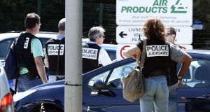 French police secure the entrance of the Air Products company in Saint-Quentin-Fallavier, near Lyon, on Friday after a decapitated head covered in Arabic writing was found. Air Products, is a US-based industrial gases technology company.  Photograph: Philippe Desmazes/AFP/Getty Images

