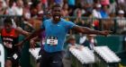  Justin Gatlin points at the clock as he celebrates winning the  200 metres at the USA Track & Field Championships in Eugene, Oregon. Photograph: Christian Petersen/Getty Images