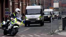 A Garda and Army convoy escorts Michael McKevitt  from the Special Criminal Court in Dublin, following a court appearance in 2003. Photograph: Eric Luke/The Irish Times