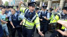 Anti-water charge protesters scuffle with Gardaí outside the Dáil. Photograph: Dave Meehan