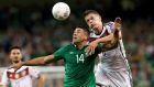 Germany’s Matthias Ginter and Republic of Ireland’s Jonathan Walters  battle for the ball. Photograph: Brian Lawless/PA Wire.