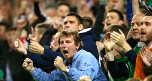 Ireland supporters celebrate Shane Long's goal against Germany at the Aviva.
Photograph: Cathal Noonan/Inpho
