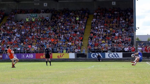   Colm Lavin de Roscommon saves a penalty taken by Rory Grugan. Photo: Bryan Keane / Inpho 