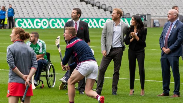   Prince Harr and Meghan Markle watch Joe Canning of Galway giving a hurling show at Croke Park. Photograph: Morgan Treacy / Inpho 