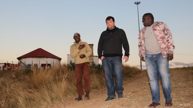   Brian Liggett (C), near Lisburn, Northern Ireland, which lives in the tribune at the land in Kwanzim village, south KwaZulu-Natal 