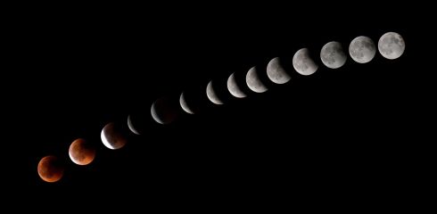   This combination of 14 images shows the moon during a total lunar eclipse near the town of La Puente, on the Spanish island of Tenerife. Photography: DESIREE MARTINDESIREE MARTIN / AFP / Getty Images
