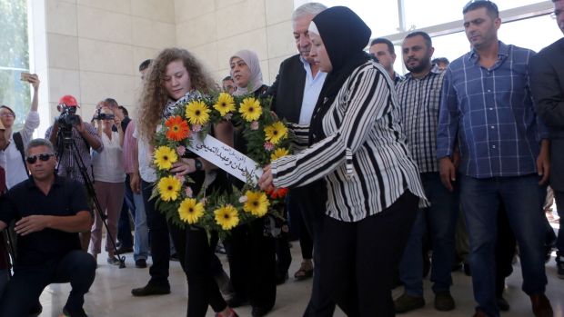   Ahed Tamimi (17) and his mother Nariman laid a wreath at the grave of the late Palestinian leader Ybader Arafat in the West Bank city of Ramallah on Sunday. Photo: Shadi Hatem / EPA 