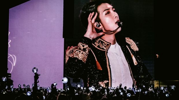 A member of the all-boy K-pop group BTS on a video screen at Citi Field in New York, October 6th, 2018. Photograph: Nina Westervelt/The New York Times