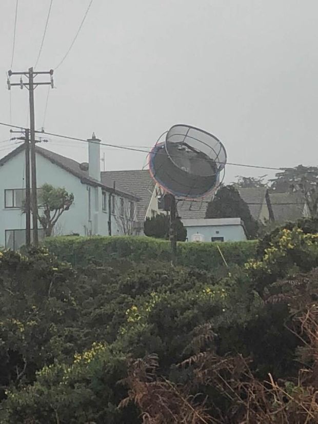 A trampoline suspended above ground in Howth, County Dublin, following strong winds Tuesday morning. Photography: Margaret Ruxton