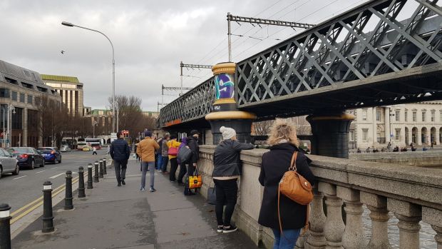 Dubliners gathered on the Butt Bridge to watch the dolphon. Photo: Paddy Logue