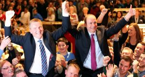 Fianna Fáil Leader Micheal Martin (right) and Michael McGrath (left) celebrate after they were elected at City Hall in Cork on Saturday. Photograph: PA 