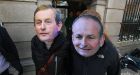 Participants in a Robinhoodtax.ie protest outside the Dáil last week wearing masks of acting Taoiseach Enda Kenny  and Fianna Fáil leader Micheál Martin TD. Photograph:  Nick Bradshaw/The Irish Times