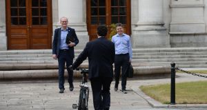  Simon Coveney and Paschal Donohoe greeting Green PAEamon Ryan Leader of the Green Party as he arrives for talks on Government formation at Government BuildingsPhotograph: Alan Betson / The Irish Times