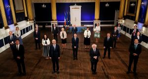 President Michael D Higgins presents new Ministers with their seal of office. Photograph: Maxwells