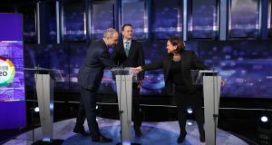 Fianna Fáil leader Micheál Martin shakes hands with Sinn Féin president Mary Lou McDonald as Fine Gael leader Leo Varadkar looks on at the final TV leaders’ debate at the RTÉ studios in Donnybrook, Dublin in February, 2020. Photograph:  Niall Carson/PA Wire 